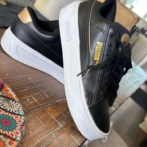 Puma Black and Gold Athletic Shoes